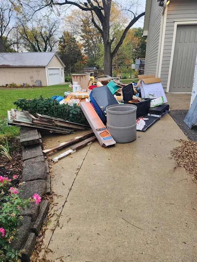 Dumpster being loaded with debris for Demolition Dumpster Rental in Canajoharie